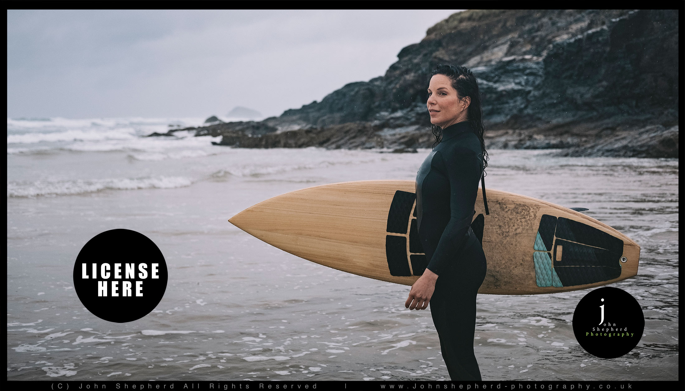 Female Surfer in the rain.